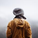 person overlooking misty valley